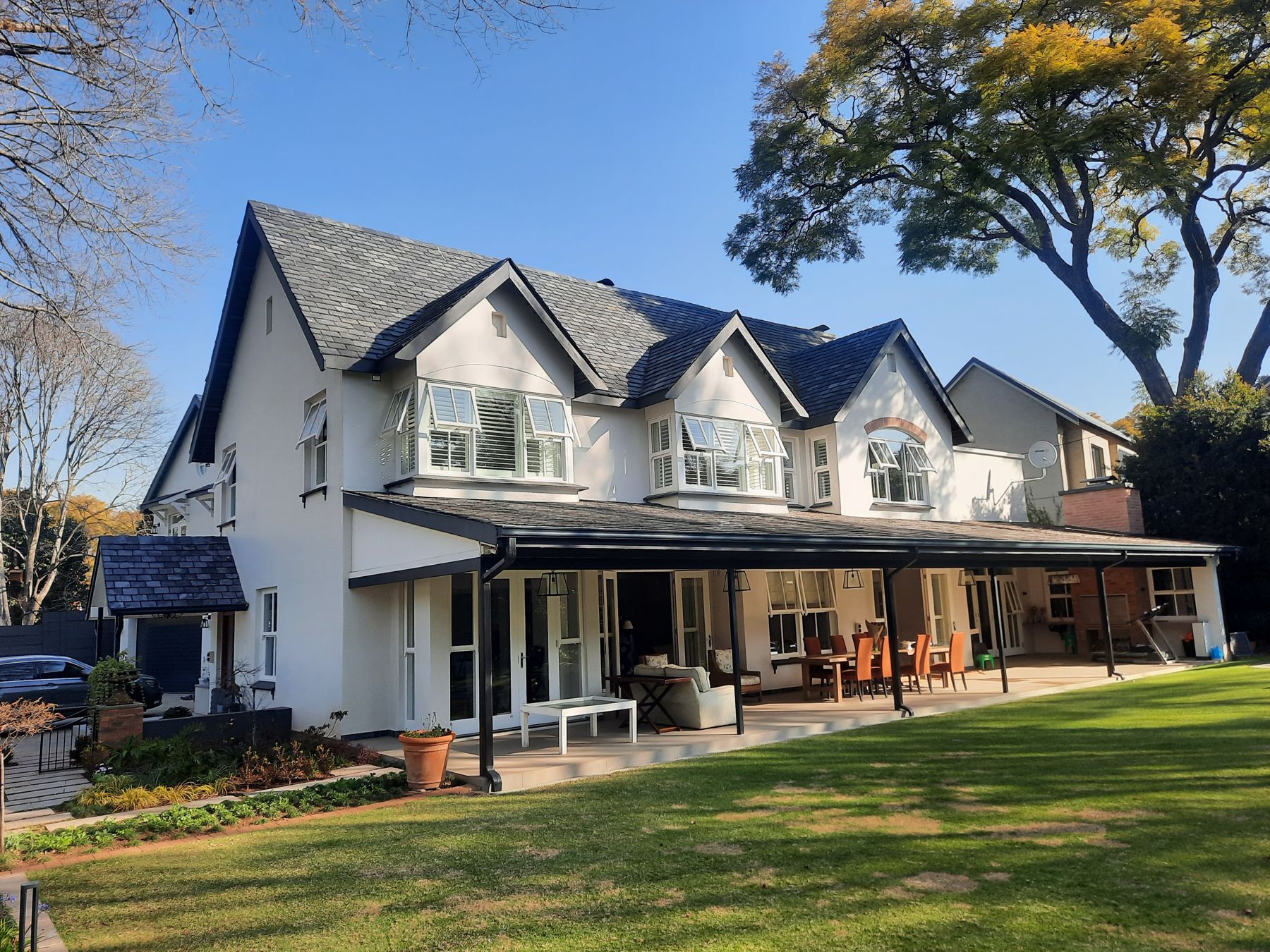 Gabled heritage house in Melrose after the alteration, with slate roofs and a new garden verandah
