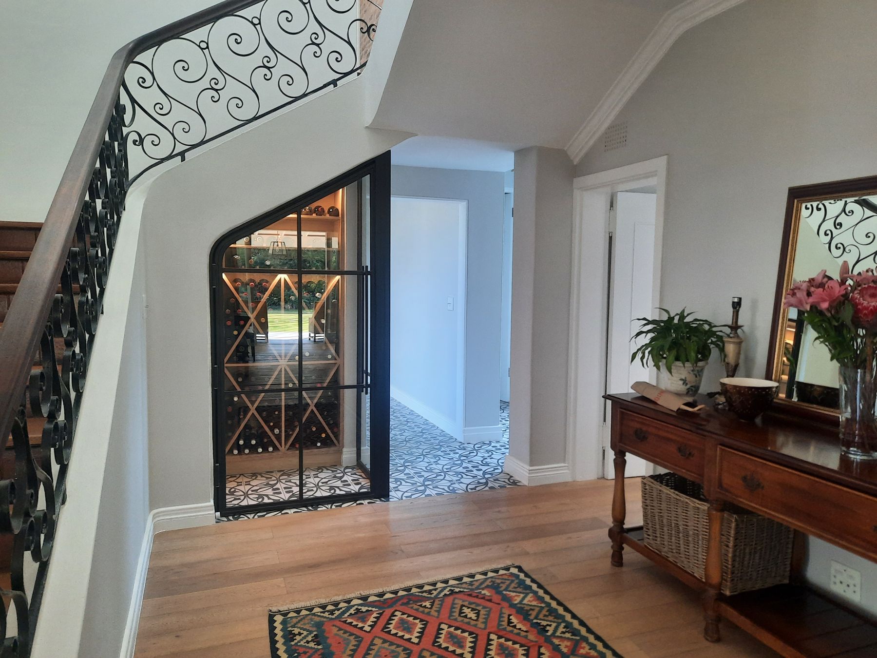 Glazed wine store beneath the new stair — Heritage house in Melrose